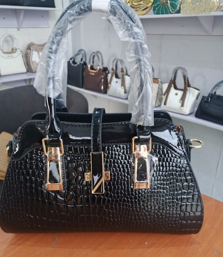 Black crocodile-embossed pillow satchel