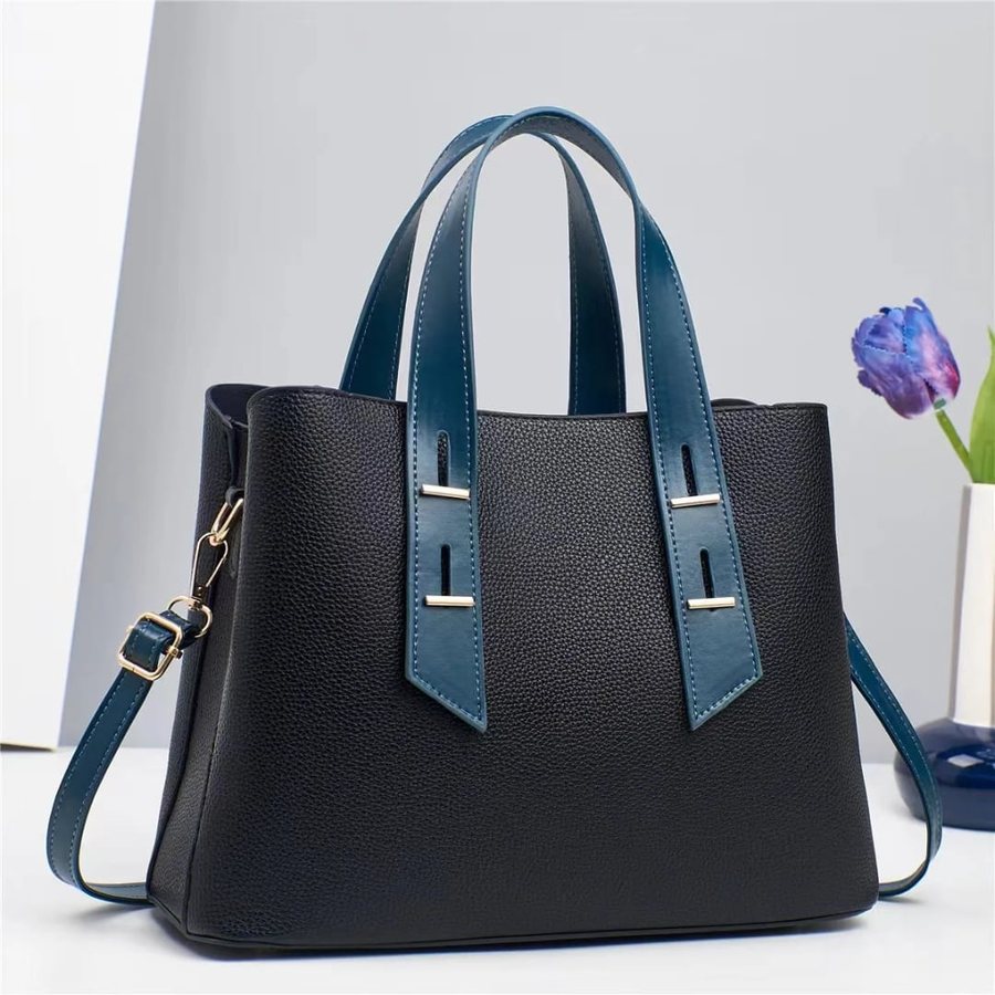 Black wide-strap tote with teal straps