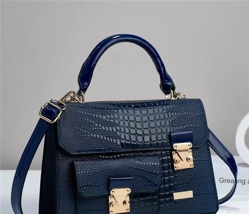 Navy blue crocodile-embossed satchel with gold locks